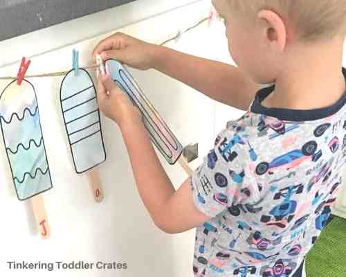 Toddler creating new things with a tinkering toddler crate subscription box