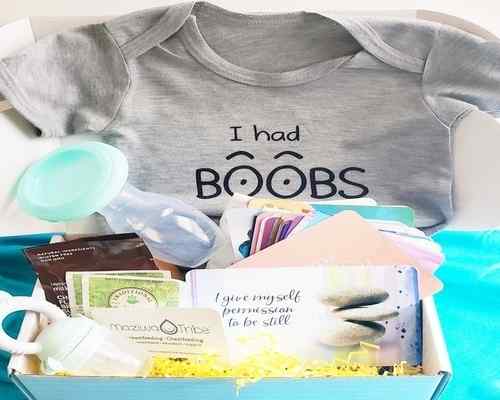 A subscription box full of lactation tools, t-shirt and other cards and products.