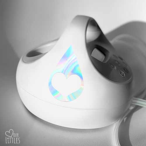 Breast pump with breast milk drop and heart cut out sticker in holographic material.