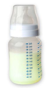 Green breast milk in a baby bottle.
